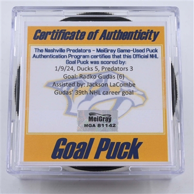 Radko Gudas - Anaheim Ducks - Goal Puck - January 9, 2024 vs. Nashville Predators (Predators 25th Anniversary Logo)
